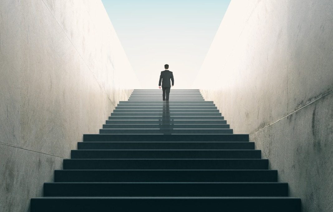 businessman climbing stairs