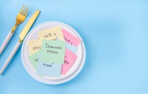 Plate full of post-it notes on a blue background