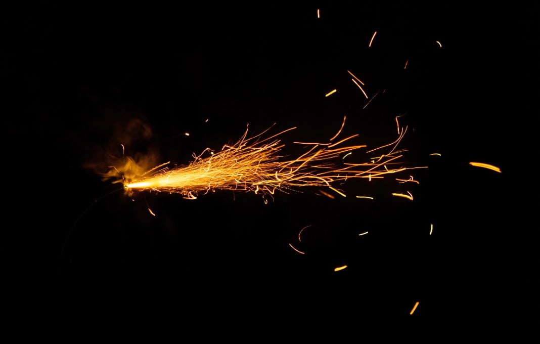 Burning fuse on black background