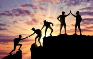 Conceptual scene of alpinists and teamwork