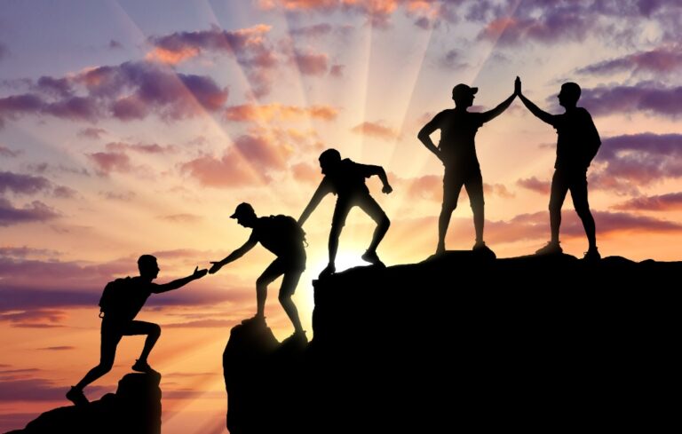 Conceptual scene of alpinists and teamwork