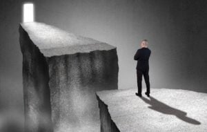 Man needing to get past chasm to opportunity