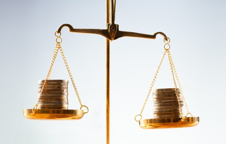 Stacked coins on scale