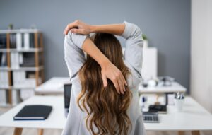 Businesswoman Stretching Her Arms