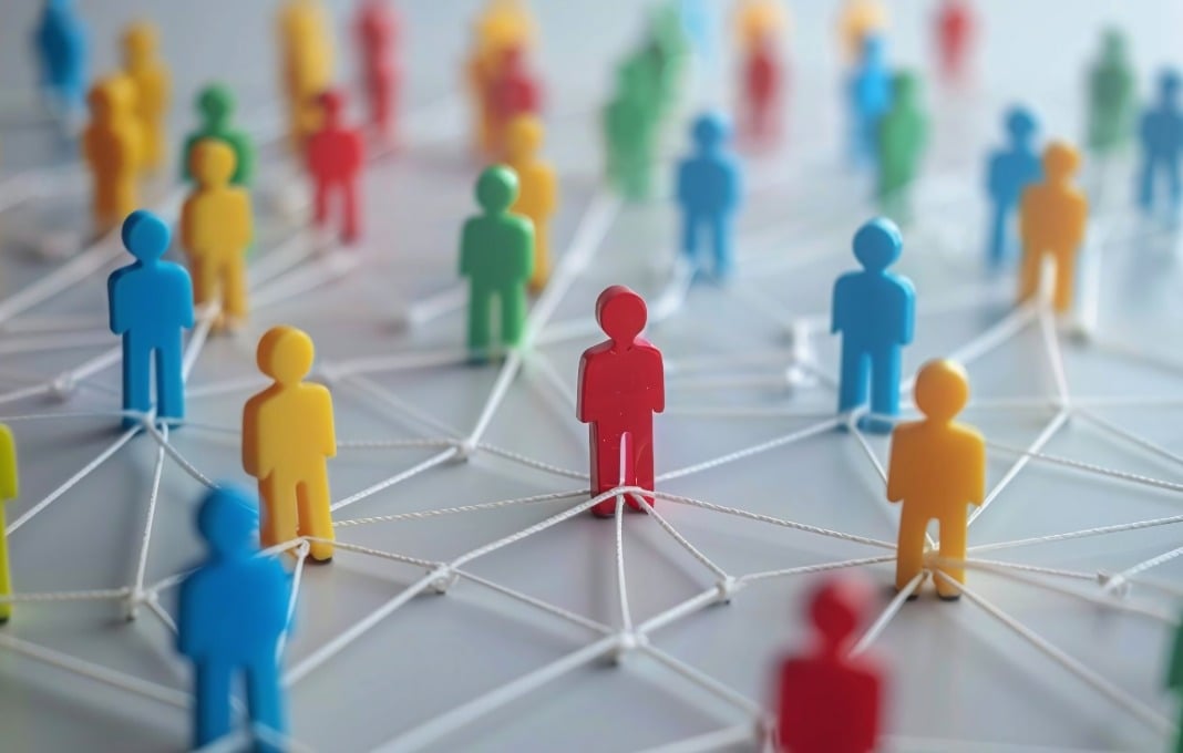 Colorful wooden figures connected by string