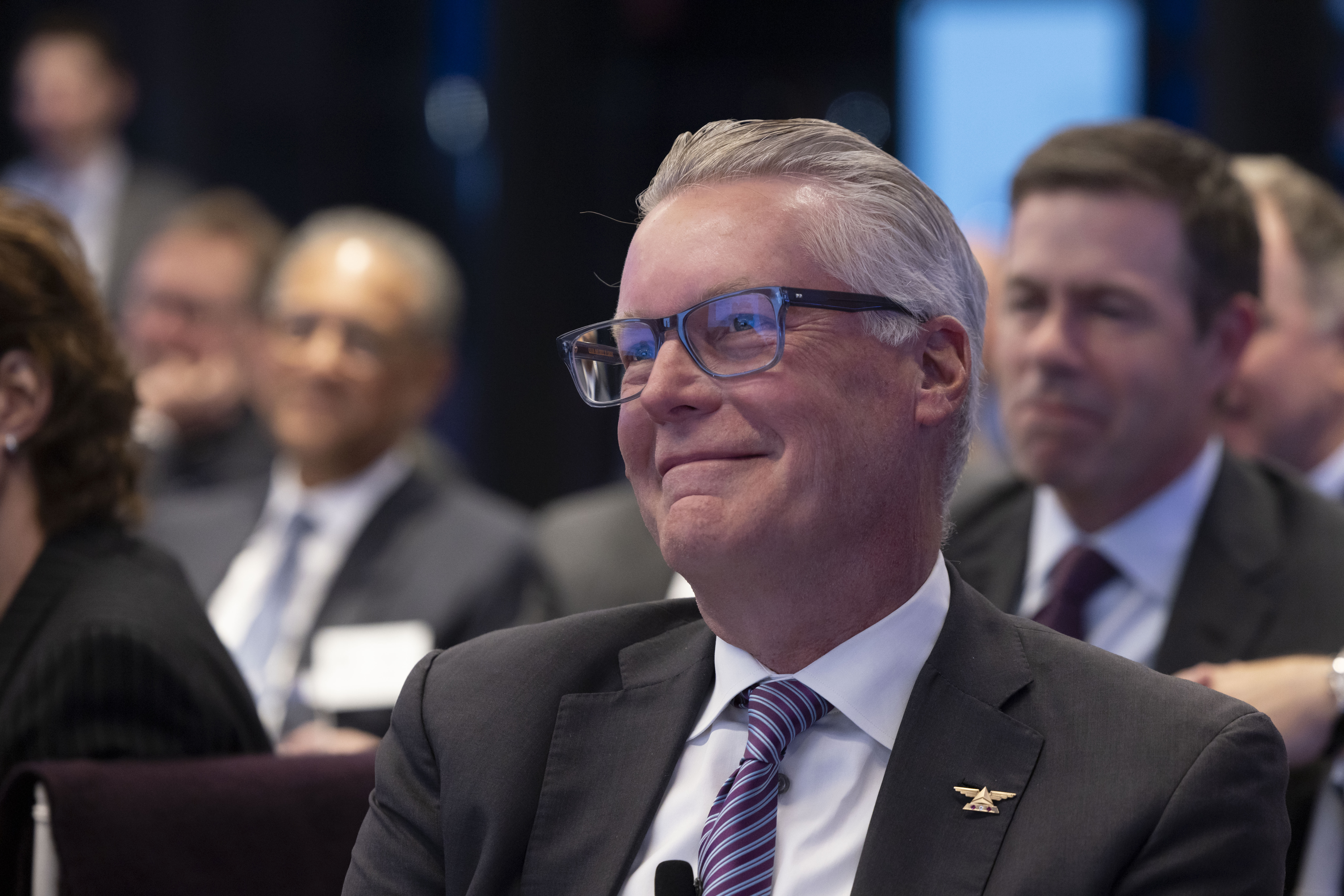 Close up of Ed Bastian smiling at his seat during the CEO of the Year award was being presented to him