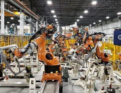 Manufacturing robots in process.